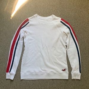 Hollister crew neck white sweater with stripes in a size XS